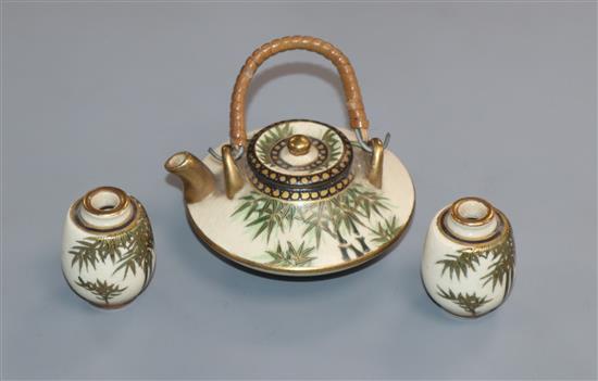 A Japanese Satsuma pottery miniature tea pot and two vases